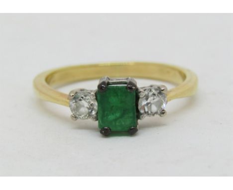 Emerald and diamond ring in unmarked yellow metal, diamonds 0.15cts each approx, emerald 5 x 4mm approx, size O/P, 3.1g