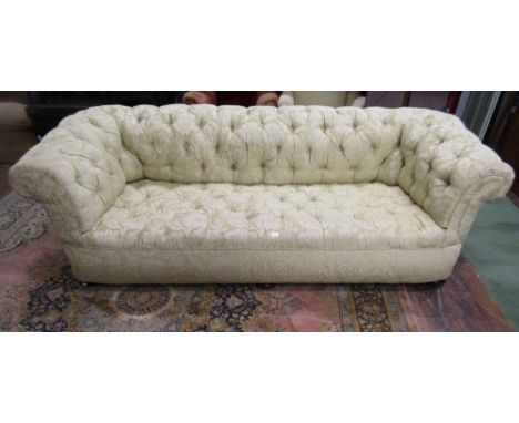 A large Victorian button back Chesterfield sofa, recently re upholstered, raised on bun supports, 2.5m long