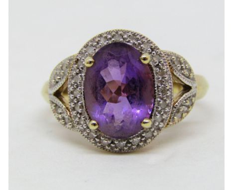 Amethyst and diamond set fancy dress ring in yellow metal, size P, 4g
