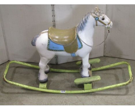 A vintage Tri-ang rocking horse, the body of moulded form raised on a metal rocker, total length 90 cm