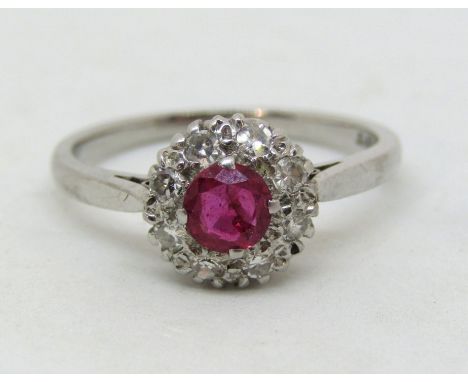 Pink ruby and diamond halo cluster ring in 18ct white gold, size M, 3.1g