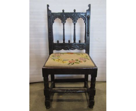 A simple foldover top card table on square taper legs with ebonised finish, together with a Yorkshire spindle back side chair