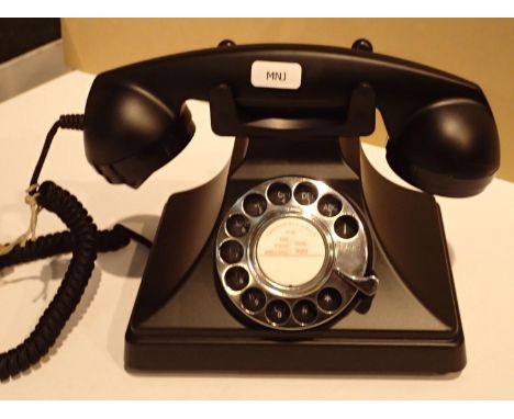 The GPO 200 rotary telephone has a metal base and handset; traditional cloth handset curly cord &amp; is compatible with stan