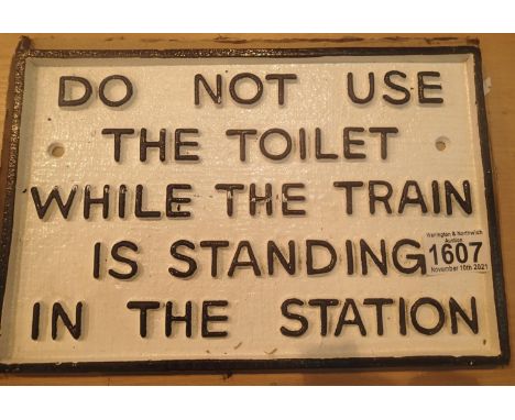 Cast iron Do Not Use The Toilet When The Train Is Standing At Station sign, L: 29 cm. P&amp;P Group 1 (£14+VAT for the first 