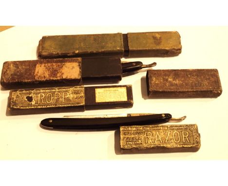 Three cased cut throat razors; Voogd, Kropp and a Sheffield made example. P&amp;P Group 1 (£14+VAT for the first lot and £1+V