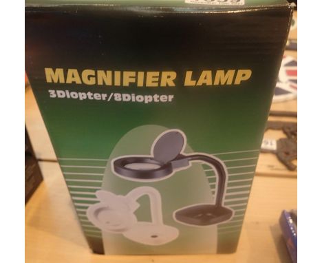 A boxed 3/8 dioptre electric magnifying lamp. P&amp;P Group 2 (£18+VAT for the first lot and £3+VAT for subsequent lots) 