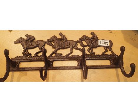 Cast iron Horse and Jockey coat rail, L: 40 cm. P&amp;P Group 2 (£18+VAT for the first lot and £3+VAT for subsequent lots) 