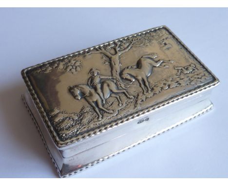 A late 19th/early 20th Century Dutch silver Snuff Box, the hinged lid decorated in relief with two horses (one having just un