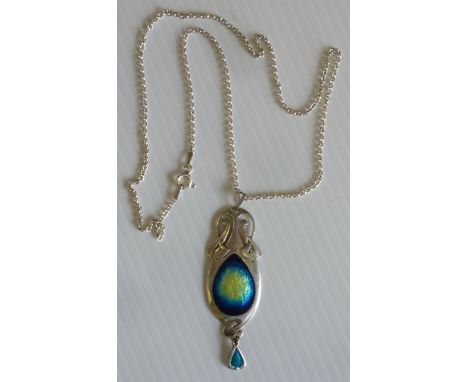 An Archibald Knox design silver and enamel Pendant with enamel centre and dropper, mounted on a modern silver Chain, (rubbed 