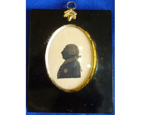 A miniature Portrait Silhouette of George III, late 18th / early 19th  century, in a black and gilt painted wooden frame with