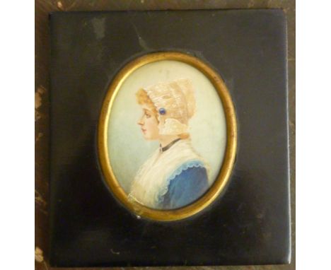A 19th Century oval shoulder length Portrait Study of a young girl in lace bonnet and blue dress