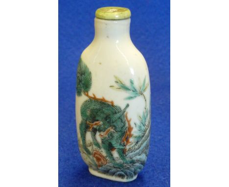 A Chinese Kangxi style porcelain Snuff Bottle of oval section, hand decorated in Famille Vert enamels with a Qilin upon rocky