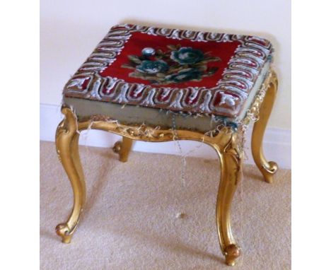 A mid 19th Century giltwood Stool, the elaborate hand stitched beadwork top depicting a central floral spray above cabriole l