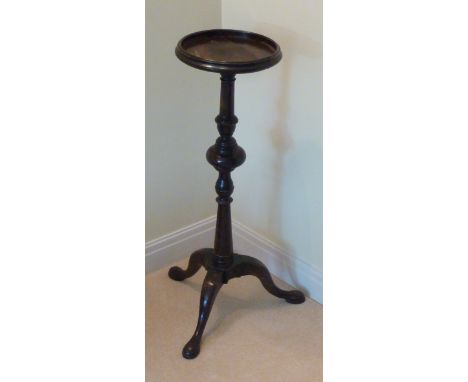 An 18th Century style mahogany Kettle Stand, dished top (broken) above a turned stem and tripod base terminating in pad feet,