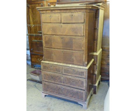An early 18th Century walnut Chest on Chest Top, cushion moulded drawer, two half width and three full width graduated figure