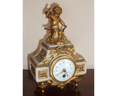A late 19th Century French white marble and ormolu mounted Mantel Clock of small proportions (in Louis XVI style), the cherub
