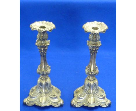 A pair of 19th Century French style Candlesticks of elaborate form decorated with acanthus leaves and on tripod bases with va