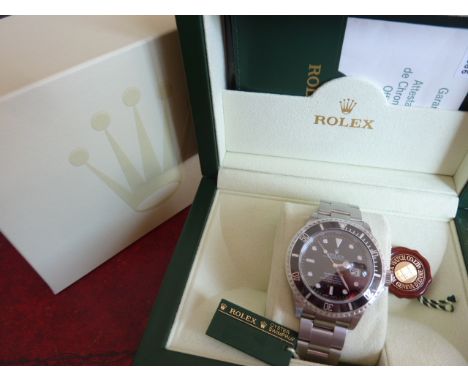 A gentleman's boxed Rolex Submariner Oyster perpetual date superlative chronometer Wristwatch, Model 16610, with black dial a