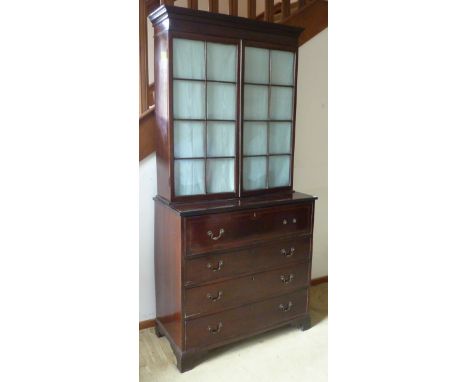 A Regency period mahogany Secretaire Cabinet, the Greek key style fret above two glazed doors with astragal glazing bars and 