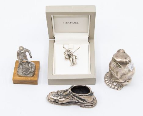 A collector's lot to include: 800 standard silver pin cushion holder cast as a shoe; a white metal Frog salt; a sterling silv