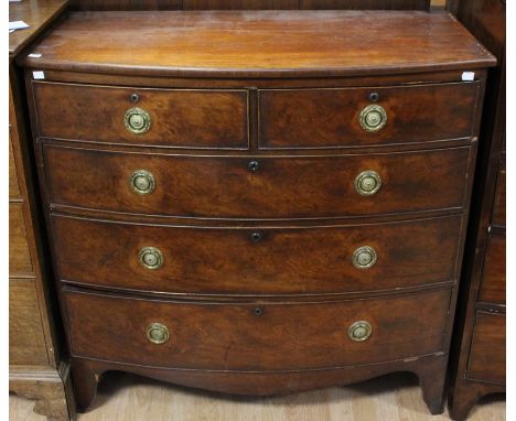 A George III mahogany bow fronted chest of drawers, circa 1810, comprising two short drawers over three long graduated drawer