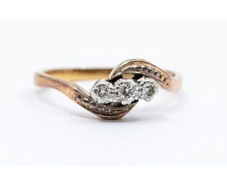 A diamond and 9ct gold cross over ring, diamond weight approx 0.10ct,  size N1/2, total gross weight approx 3.2gms  Condition