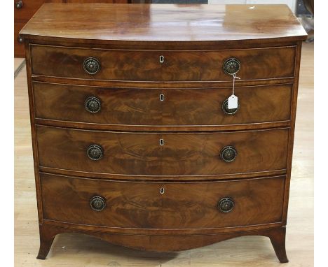 A George III mahogany chest of drawers, bow fronted form, fitted with four drawers with original locks, 87cm high, 94cm wide,