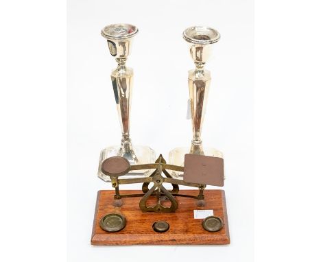 A pair of George V silver candlesticks, Chester 1911, filled bases, approx 22cm high (one candlestick - AF requires resolderi