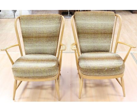 A pair of Ercol beech armchairs, rodded backs, removable cushions&nbsp;