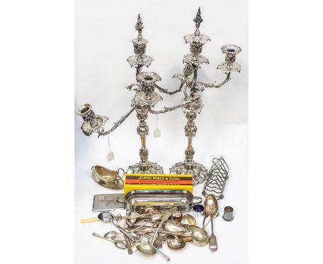 A pair of 19th Century three light candelabra, detachable arms with flame terminal stoppers, the shaped baluster stems with o