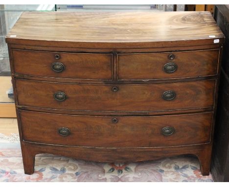 An early Victorian bow fronted mahogany chest of drawers, fitted with two short over two long graduated drawers, raised on br