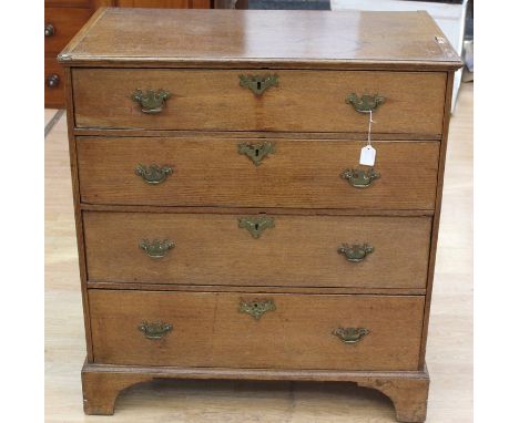 A George III oak chest of drawers, circa 1800, comprising four drawers, retaining original locks, raised on bracket feet, 96c