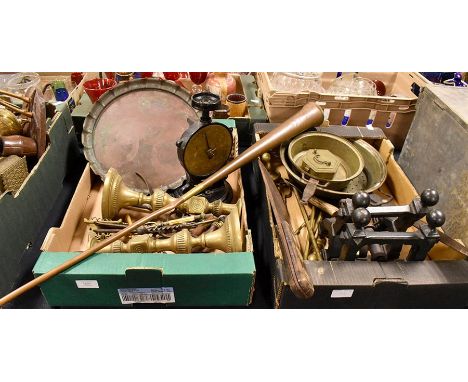 A collection of metal wares including scales, fire backs, large pots, trays, shooting sticks, candlesticks, and other metal i