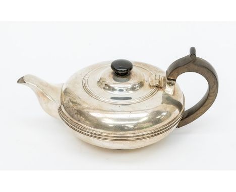 An George V&nbsp; silver squab shaped teapot, ebonised finial and fruitwood handle, Sheffield, 1912, gross 20.15 ozt&nbsp;