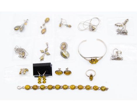 A collection of silver and white metal yellow amber set jewellery to include a bracelet, a bangle, a ring, two pairs of stud 