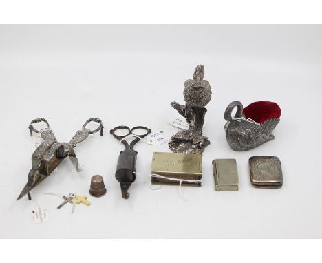 A Country Artist 925 silver model of a Wren together with an early 20th Century plated large Swan pin cushion further white m