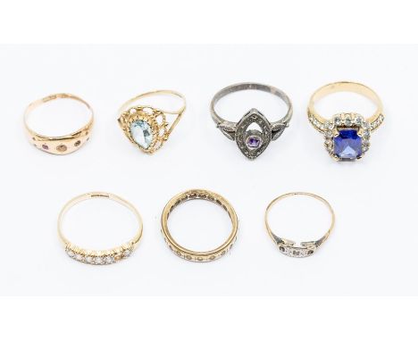 A collection of assorted dress rings, including 9ct gold topaz coloured dress ring, a 9ct gold dress ring set with CZ's (one 