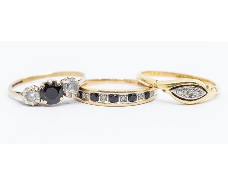 An 18ct gold and diamond set ring, size O, 2.5gms; two 9ct gold rings set with sapphires and white stones, sized N and P, gro