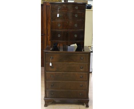 An early 20th Century mahogany chest of drawers, of bow fronted form, fitted with four drawers, raised on splayed bracket fee