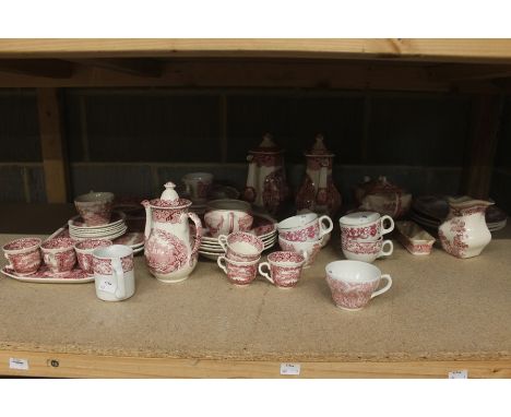 A collection of red and white teawares, comprising coffee pots, soup dishes, plates, teapot, coffee cups, saucers, teacups, e