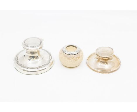 Two silver capstan inkwell, graduating sizes, the larger with reeded decoration by Birmingham, 1924 (CR: marks good, dents to