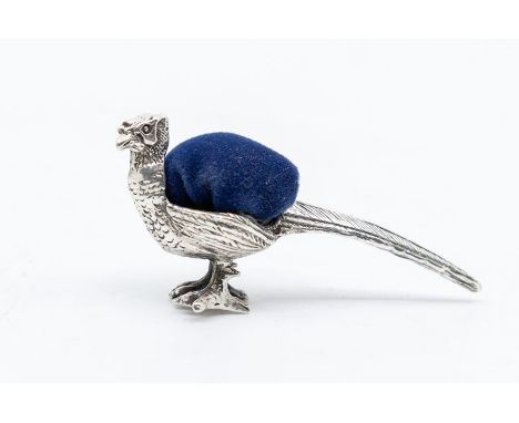 A silver pin cushion in the form of a pheasant, length approx 45mm, height approx 20mm, stamped 925, weight approx 9gms condi