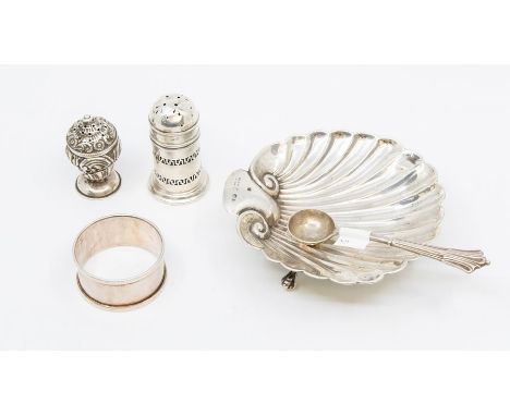 A collection of table silver to include: shell shaped butter dish, Onslow pattern jam spoon, two various pepper pots and a na