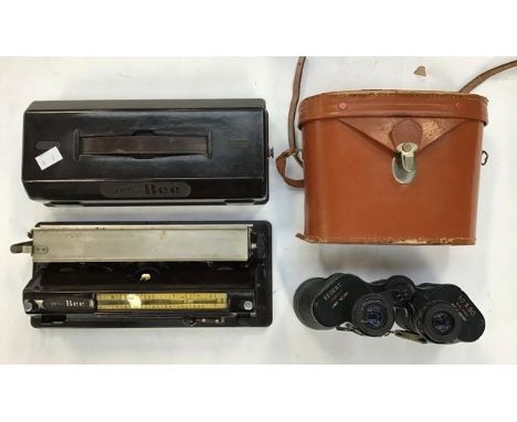 Small 1930's Baby Bee typewriter along with a pair of binoculars in case