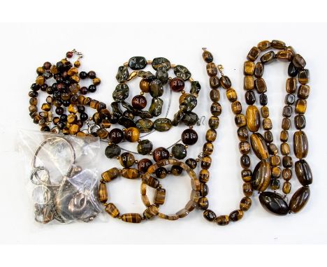A collection of jewellery to include tigers eye bead necklaces along with two bracelets and a tigers eye pendant and chain, a