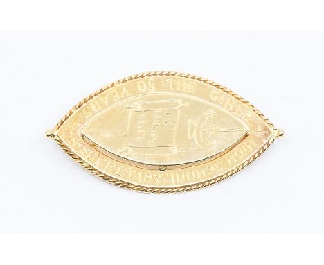A 9ct gold navette shaped presentation brooch, inscribed 'in lumine luce' length approx 40mm, roller clasp and pin, stamped 9