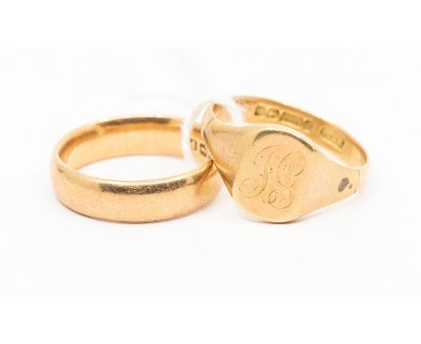 A 9ct gold wedding band, width approx 5mm, size S, along with a 9ct gold signet ring, monogrammed cartouche, size V, combined