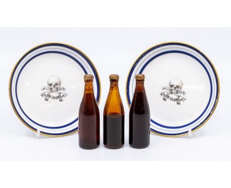 Two Royal Worcester china pub ashtrays, skull and crossbones or glory, with three Guinness bottles