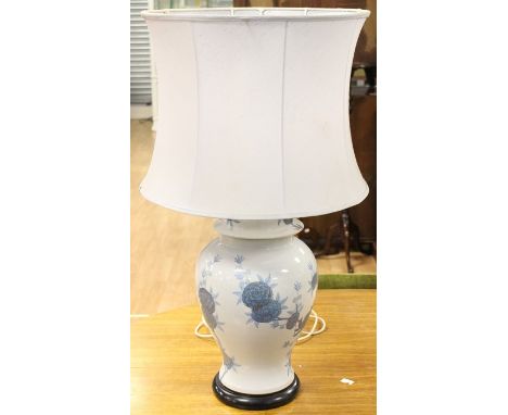 A late 20th Century table lamp with shade, the base in the form of a vase and cover, hand finished with floral decoration and