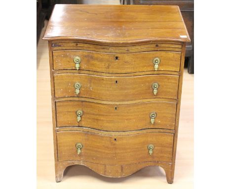 A Georgian style serpentine fronted mahogany chest of drawers, comprising brushing slide over four graduated drawers, splayed